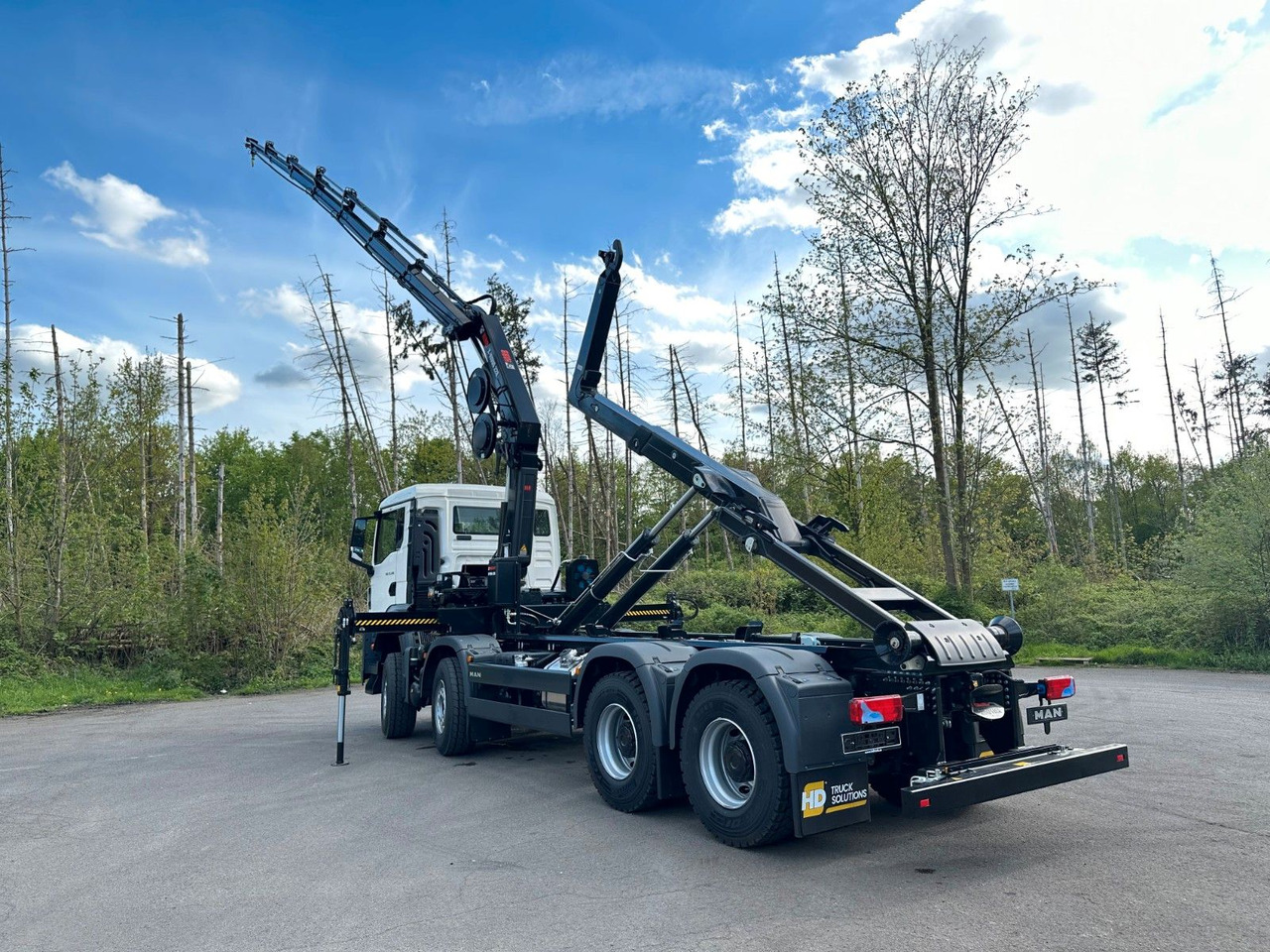 Camión multibasculante MAN TGS 35.520 8x4  Abrollkipper + Kran HIAB 228-6