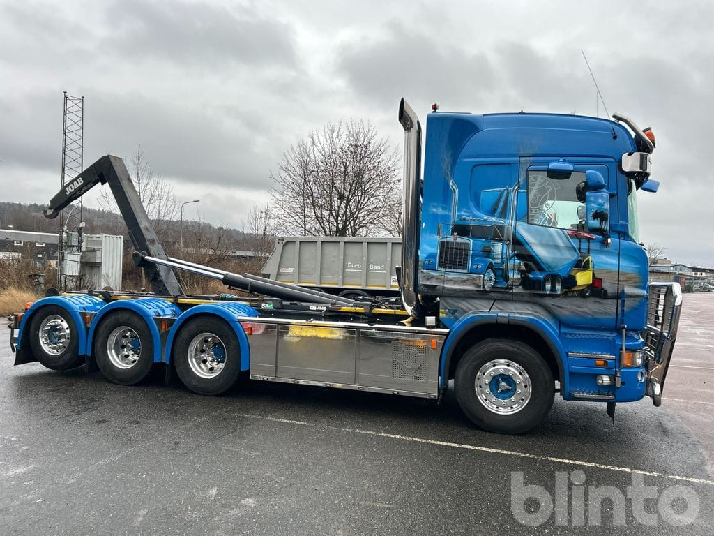 Camión multibasculante SCANIA R560LB 8X4*4 med JOAB 24T krok