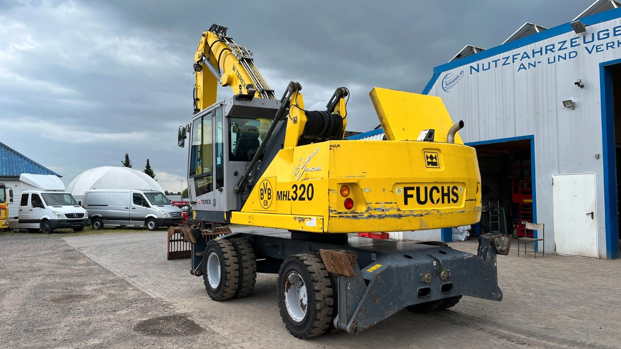 Manipulador de materiales Fuchs TeRex MHL 320 D Umschlagbagger Greifer Pratzen: foto 6