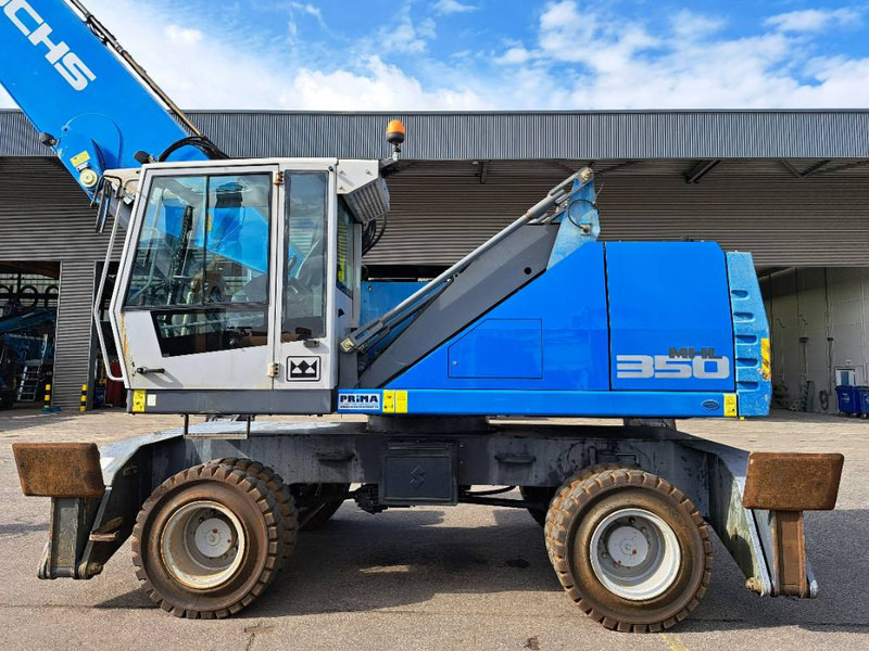 Manipulador de materiales para transporte de basura Fuchs MHL 350 E: foto 7