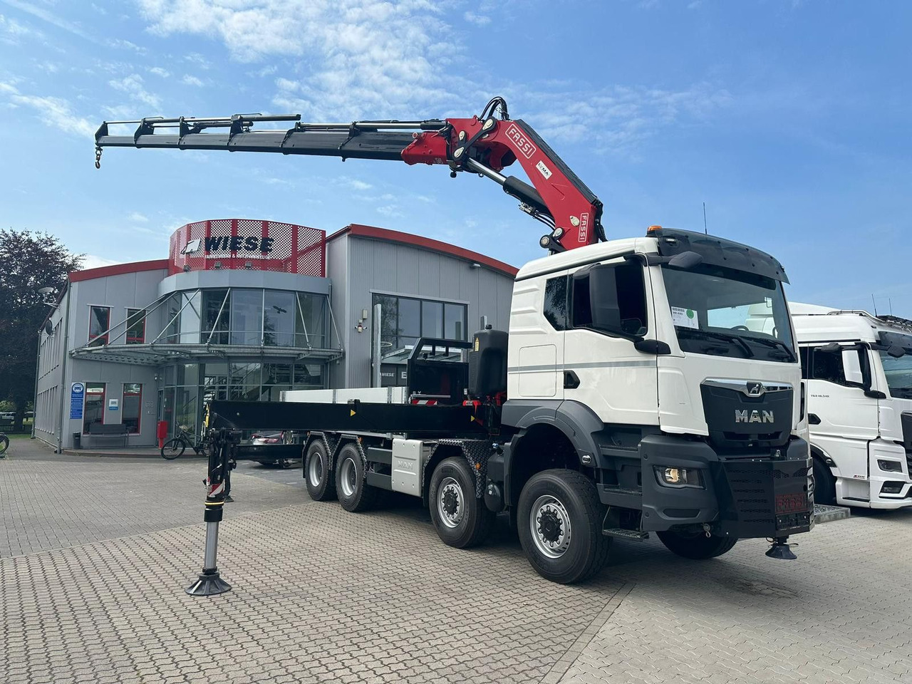 MAN TGS 41.520 8x8 mit Fassi Ladekran F710RA.2.26 - Camión caja abierta: foto 1 MAN TGS 41.520 8x8 mit Fassi Ladekran F710RA.2.26 - Camión caja abierta: foto 1