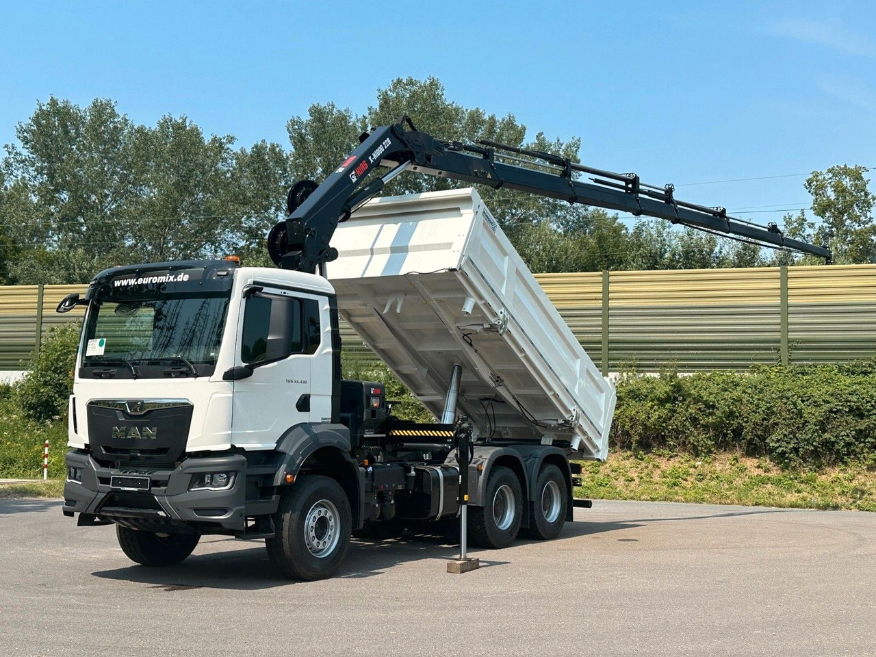 MAN TGS 33.440 6x4 /3-Seiten- Kipper / HIAB 228-6 - Camión volquete, Camión grúa: foto 1 MAN TGS 33.440 6x4 /3-Seiten- Kipper / HIAB 228-6 - Camión volquete, Camión grúa: foto 1