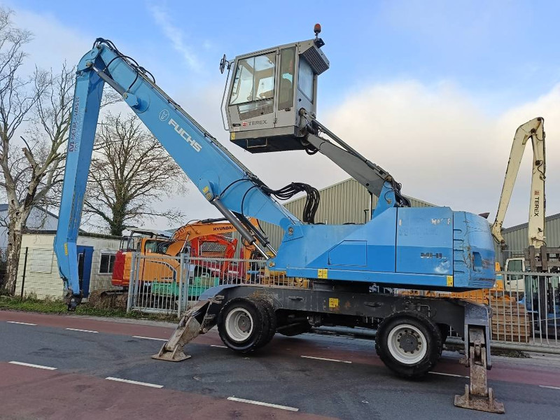Fuchs MHL 350 industry waste handler umslagbagger - Manipulador de materiales: foto 1 Fuchs MHL 350 industry waste handler umslagbagger - Manipulador de materiales: foto 1