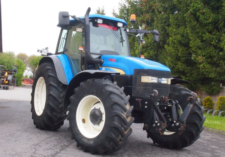 Ciągnik New Holland TM 140 2004 Przedni TUZ - Tractor: foto 2 Ciągnik New Holland TM 140 2004 Przedni TUZ - Tractor: foto 2
