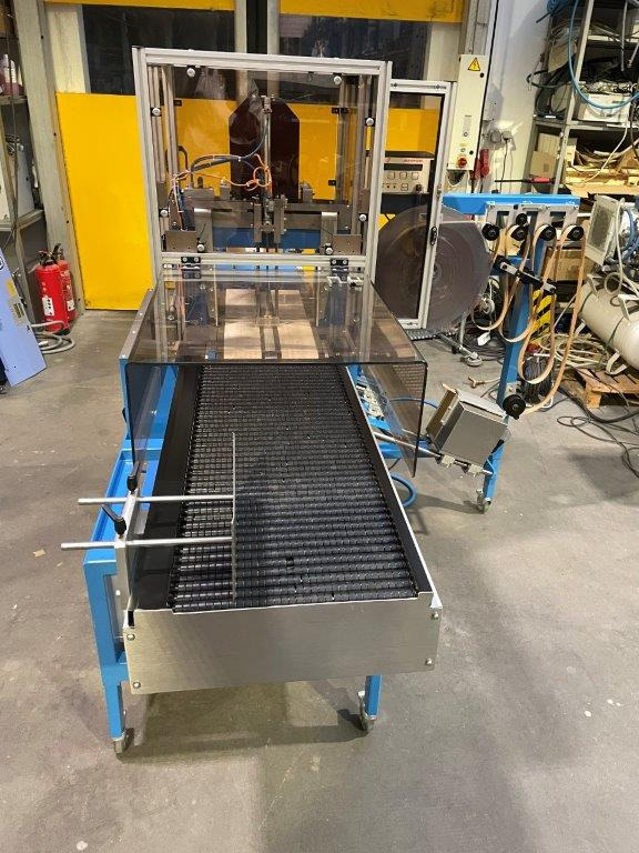 ATS Tanner UltraSonic US 2000-AB transit banding machine with pneumatic product hold-down and infeed roller table - Máquina de embalaje: foto 4 ATS Tanner UltraSonic US 2000-AB transit banding machine with pneumatic product hold-down and infeed roller table - Máquina de embalaje: foto 4