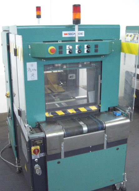 Signode Newsmaster 5500 cross strapping machines - Máquina de embalaje: foto 1 Signode Newsmaster 5500 cross strapping machines - Máquina de embalaje: foto 1