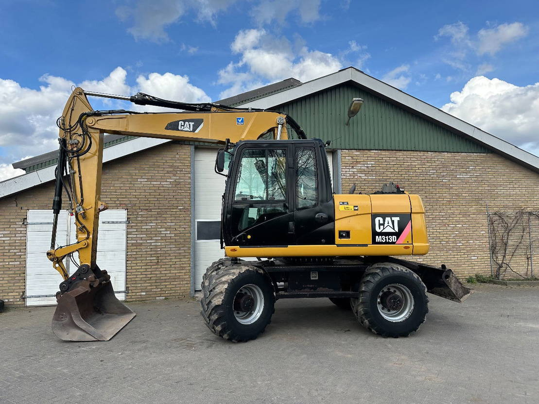 Caterpillar M313D - Excavadora de ruedas: foto 1 Caterpillar M313D - Excavadora de ruedas: foto 1