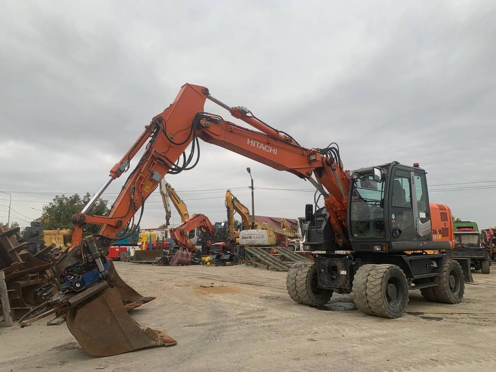 Hitachi ZX 145 W-3+SMP Rototilt  - Excavadora de ruedas: foto 1 Hitachi ZX 145 W-3+SMP Rototilt  - Excavadora de ruedas: foto 1