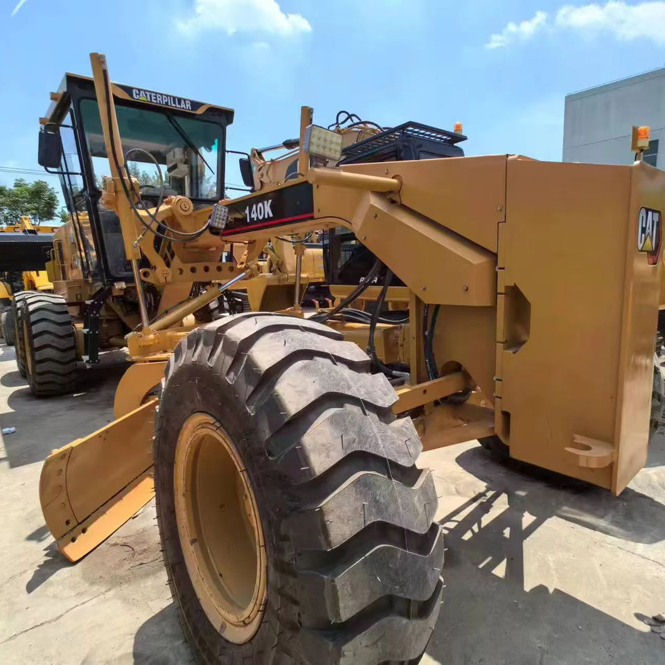 Second Hand Used Construction Machinery CAT 140K 15 Ton Grader for Sale 1000H From Shanghai Japanese Brand Good Condition - Grader: foto 1 Second Hand Used Construction Machinery CAT 140K 15 Ton Grader for Sale 1000H From Shanghai Japanese Brand Good Condition - Grader: foto 1