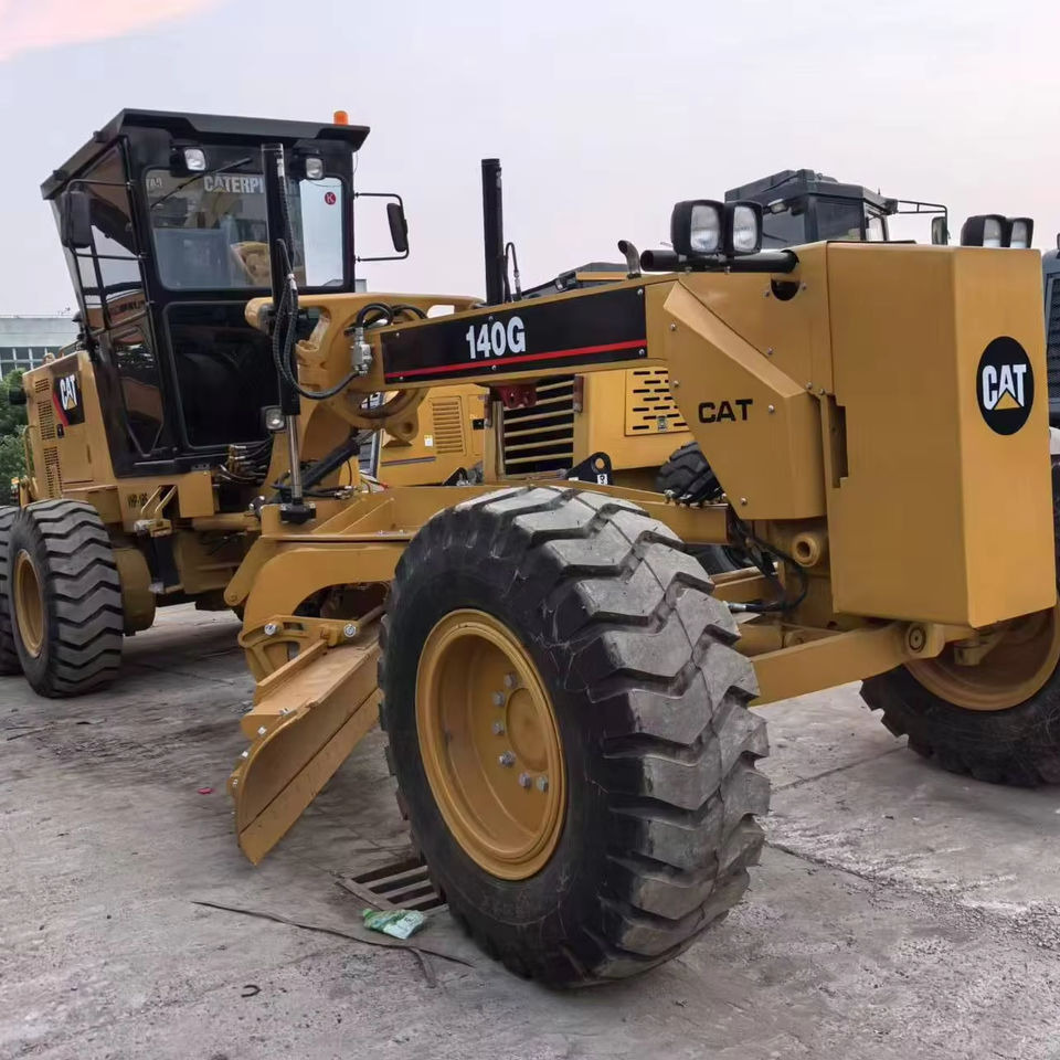 Second Hand Used Construction Machinery Japanese CAT 140G Grader Caterpillar Brand for Sale With Good Condition and Price - Grader: foto 1 Second Hand Used Construction Machinery Japanese CAT 140G Grader Caterpillar Brand for Sale With Good Condition and Price - Grader: foto 1