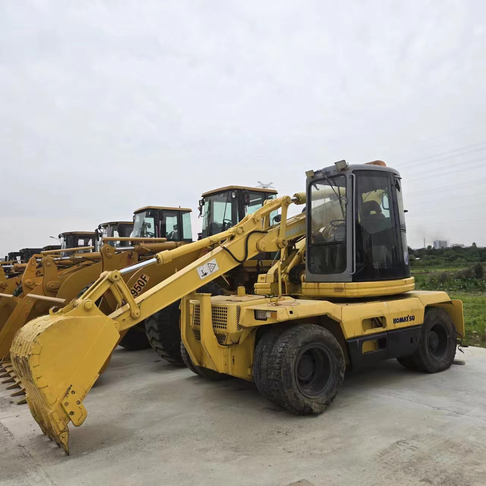KOMATSU PC128US - Excavadora de ruedas: foto 1 KOMATSU PC128US - Excavadora de ruedas: foto 1