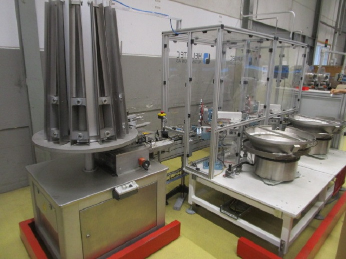 DECKEL ETIKETTIER ANLAGE SCHLEUTER GU 2 DO MIT 2xLÖFFELEINLEGESTATIONEN - Máquina de embalaje: foto 1 DECKEL ETIKETTIER ANLAGE SCHLEUTER GU 2 DO MIT 2xLÖFFELEINLEGESTATIONEN - Máquina de embalaje: foto 1