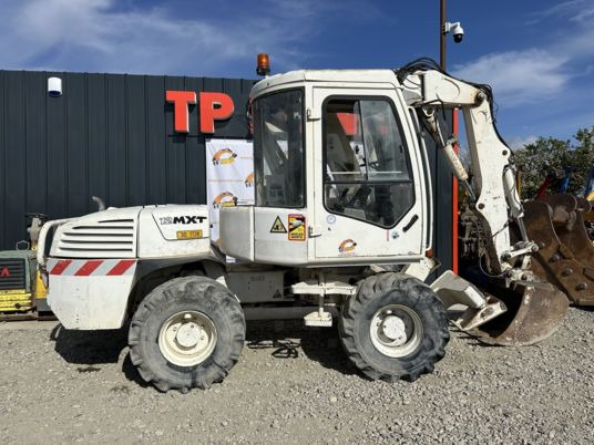 Mecalac 12MXT - Déport - Caméra x 2 - Excavadora de ruedas: foto 1 Mecalac 12MXT - Déport - Caméra x 2 - Excavadora de ruedas: foto 1