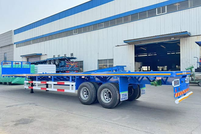TITAN 2 Axle 45 Ft Flatbed Trailers for Sale in Algeria - Semirremolque plataforma/ Caja abierta: foto 1 TITAN 2 Axle 45 Ft Flatbed Trailers for Sale in Algeria - Semirremolque plataforma/ Caja abierta: foto 1