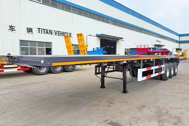 TITAN 3 Axle Flatbed Semi Trailer for Sale in Ghana - Semirremolque plataforma/ Caja abierta: foto 1 TITAN 3 Axle Flatbed Semi Trailer for Sale in Ghana - Semirremolque plataforma/ Caja abierta: foto 1