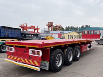 TITAN Flatbed Tri Axle Truck Trailer for Sale in Tanzania - Semirremolque plataforma/ Caja abierta: foto 2 TITAN Flatbed Tri Axle Truck Trailer for Sale in Tanzania - Semirremolque plataforma/ Caja abierta: foto 2