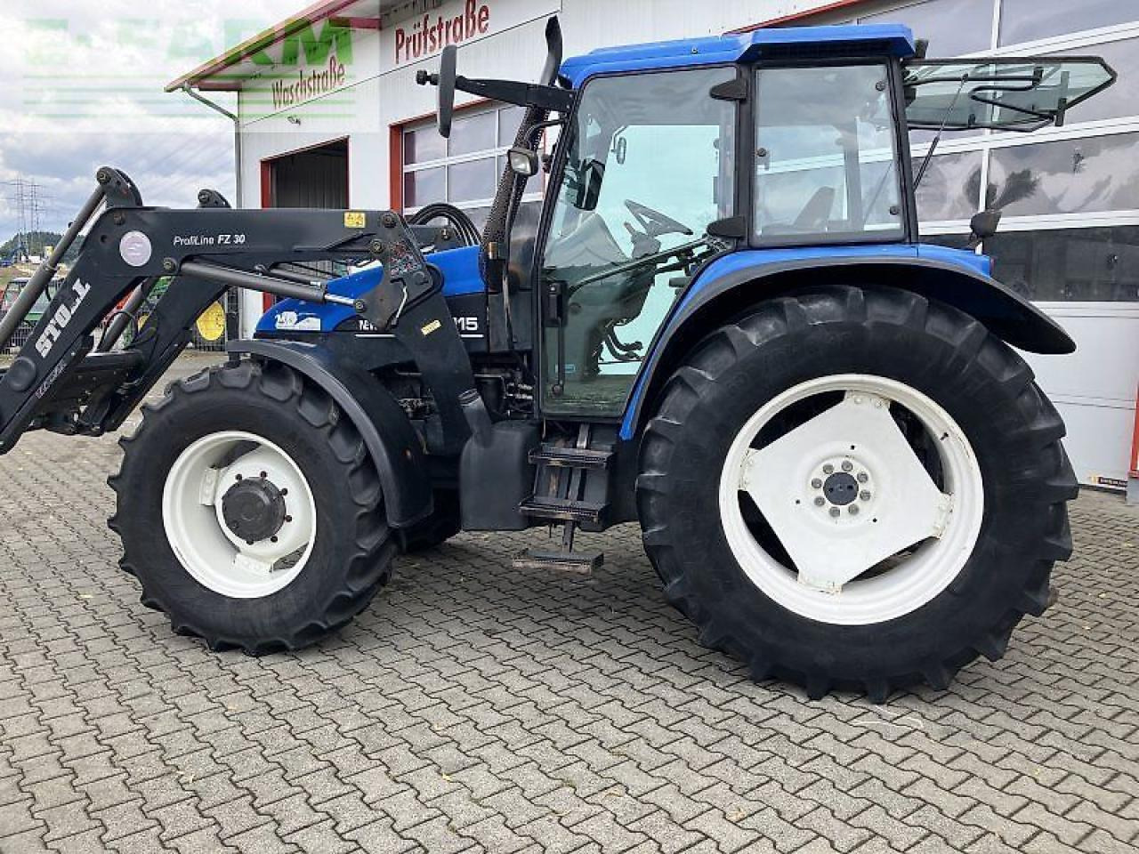 New Holland ts 115 - Tractor: foto 1 New Holland ts 115 - Tractor: foto 1