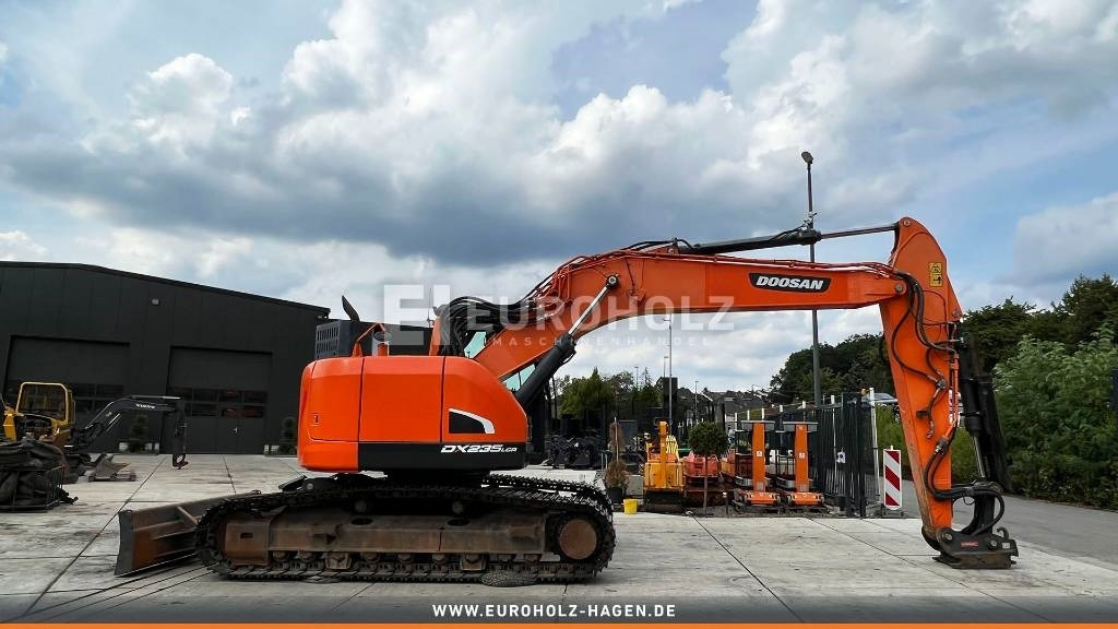 Doosan Kettenbagger DX 235 LCR-5, hyd. SW OilQuick 70-55 - Excavadora de cadenas: foto 1 Doosan Kettenbagger DX 235 LCR-5, hyd. SW OilQuick 70-55 - Excavadora de cadenas: foto 1