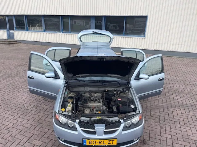 Hatchback Nissan Almera Leder bekleding APK Cruise control: foto 8 Hatchback Nissan Almera Leder bekleding APK Cruise control: foto 8