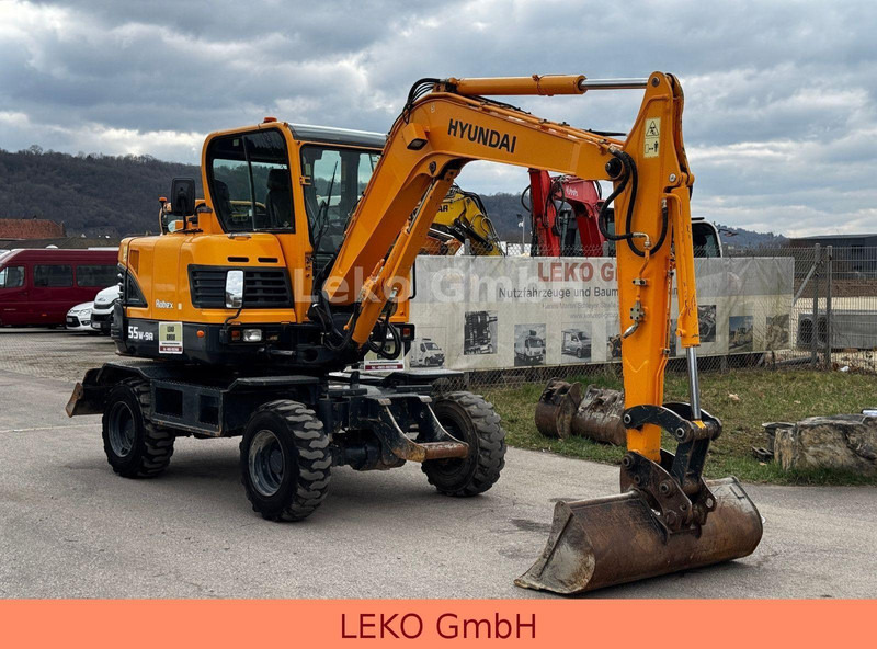 Hyundai Robex 55W-9A Mit Drei Löffeln - Excavadora de ruedas: foto 1 Hyundai Robex 55W-9A Mit Drei Löffeln - Excavadora de ruedas: foto 1