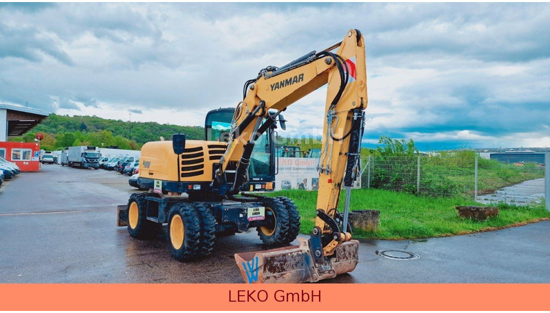 Yanmar B 95W Mit Drei Löffeln und Ein Hammer - Excavadora de ruedas: foto 1 Yanmar B 95W Mit Drei Löffeln und Ein Hammer - Excavadora de ruedas: foto 1