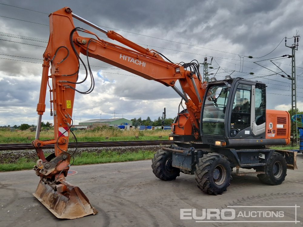 Hitachi ZX140W-3 - Excavadora de ruedas: foto 1 Hitachi ZX140W-3 - Excavadora de ruedas: foto 1