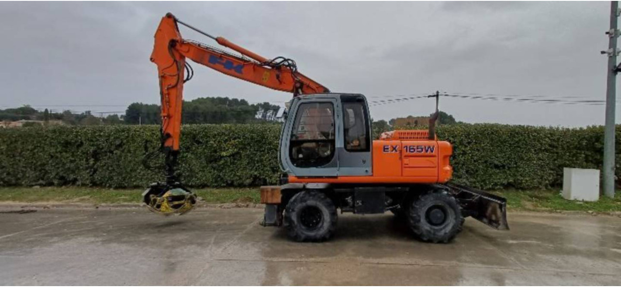 FIAT ALLIS / NEW HOLLAND EX165W - Excavadora de ruedas: foto 1 FIAT ALLIS / NEW HOLLAND EX165W - Excavadora de ruedas: foto 1